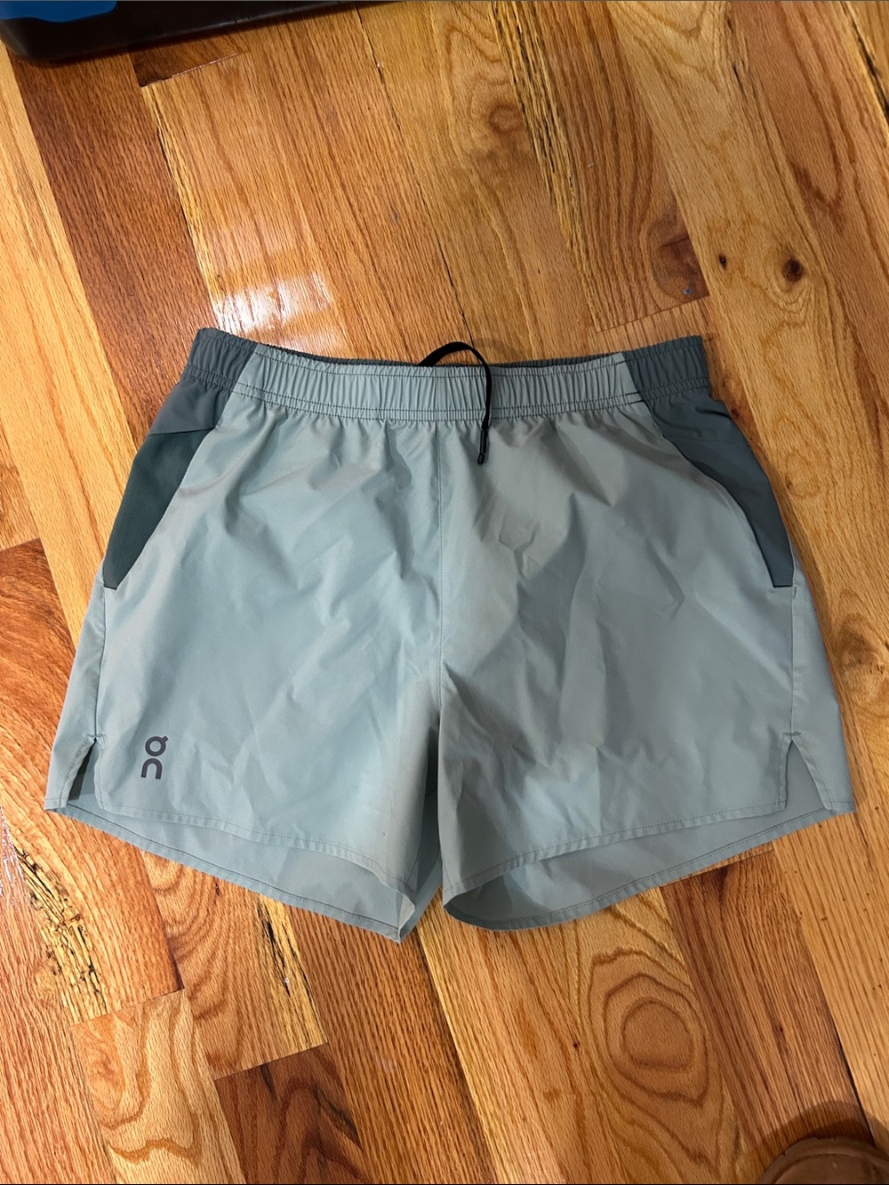 On Running Sage Green Athletic Shorts with Dark Sage Trim